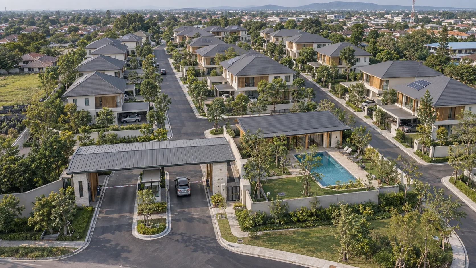 Bird's-eye 3D render: estate entrance canopy, clubhouse pool and rows of houses stretching to the horizon